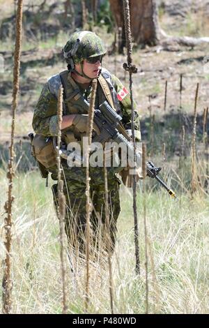 A U.S. Army unit conducts a dismounted patrol in the Abu Ghraib market ...