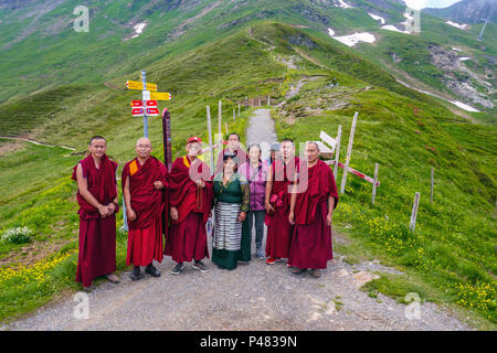 Tibetan Buddhist monks in red robes, in Switzerland Stock Photo