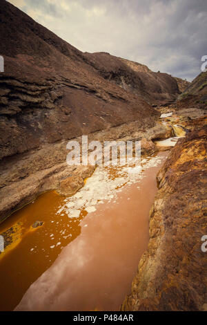 Mineral sediments in the creek Stock Photo - Alamy