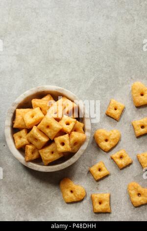 Homemade square Cheese Crackers in a bowl Stock Photo