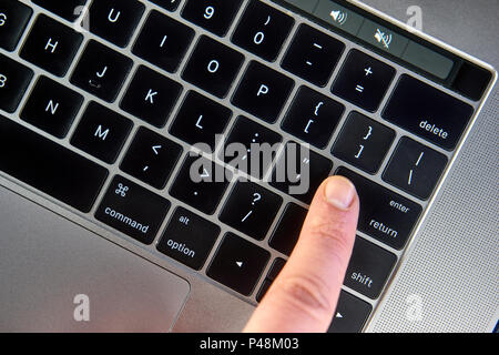 working on the laptop , work on the notebook Women finger click enter button on keyboard , Man finger click enter or return button on keyboard Working Stock Photo