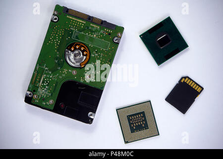 2,5 inch laptop sata hard drive with two CPU laptop processors and SD card isolated on white background Stock Photo