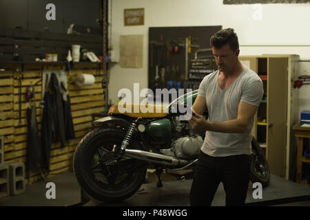 Mechanic using digital tablet Stock Photo