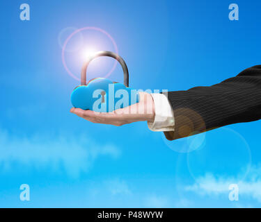 Cloud shape locker on hand with sunlight and blue sky Stock Photo