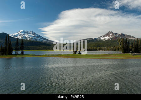 Oregon's South Sister (L.) and Broken Top (R.) as seen from the Ray Atkeson Memorial Trail at Sparks Lake, near Bend.  Atkeson, Oregon's 'Photographer Stock Photo