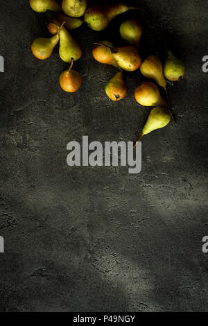 Organic Pears on Rustic Dark Background with Copy Space Stock Photo
