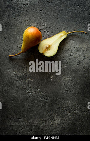Organic Pears on Rustic Dark Background with Copy Space Stock Photo