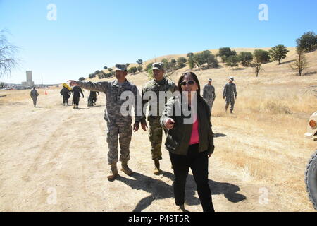 The Honorable Debra S. Wada, Assistant Secretary of the Army (Manpower & Reserve Affairs) visit Soldiers of the 29th Infantry Brigade Combat Team during their Exportable Combat Training Capability exercise Jun 16 at Camp Roberts California. XCTC focuses on fully instrumental and realistic collective training to certify platoon & company level training proficiency in coordination with First Army. Commanders and leaders assess their Soldiers strengths and weaknesses during a video review session after training which aids in their proficiency as an individual, team, platoon, unit and brigade. (U. Stock Photo