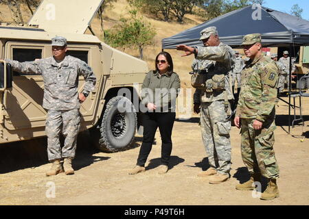 The Honorable Debra S. Wada, Assistant Secretary of the Army (Manpower & Reserve Affairs) visit Soldiers of the 29th Infantry Brigade Combat Team Soldiers during their Exportable Combat Training Capability exercise Jun 16 at Camp Roberts California. XCTC focuses on fully instrumental and realistic collective training to certify platoon & company level training proficiency in coordination with First Army. Commanders and leaders assess their Soldiers strengths and weaknesses during a video review session after training which aids in their proficiency as an individual, team, platoon, unit and bri Stock Photo