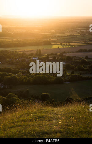 Brighton, East Sussex. 21st June 2018. UK Weather. At the end of the Summer Solstice the sun sets over Devils Dyke, on the picturesque South Downs National Park, on the longest day of the year. Summer Solstice occurs when the sun reaches it’s highest altitude of the year, and marks the height of Summer with the longest period of daylight. From tomorrow the daylight hours will gradually shorten until the Winter Solstice, in tiny unnoticeable increments. Credit: Francesca Moore/Alamy Live News Stock Photo