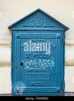 Old fashioned blue police telephone call box on wall, Santiago, Chile Stock Photo