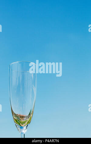 empty glass against blue sky background. Stock Photo
