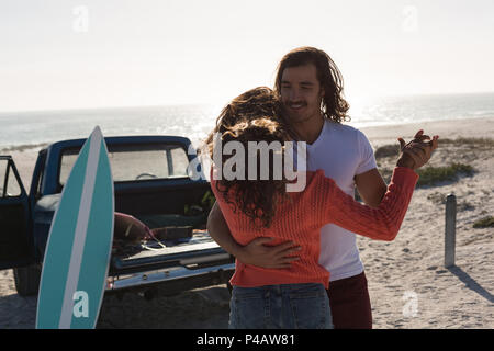 Couple dancing together in the beach Stock Photo