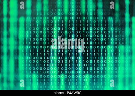 power of big data. binary code information bit on computer monitor screen display. green light text number one and zero. blur defocus blue bokeh light Stock Photo