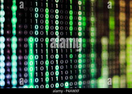 power of big data. binary code information bit on computer monitor screen display. green light text number one and zero. blur defocus blue bokeh light Stock Photo