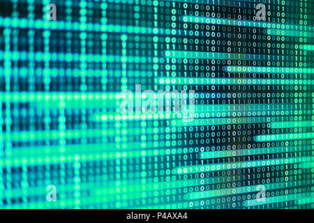 power of big data. binary code information bit on computer monitor screen display. green light text number one and zero. blur defocus blue bokeh light Stock Photo
