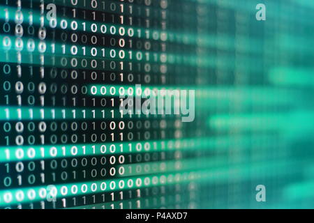 power of big data. binary code information bit on computer monitor screen display. green light text number one and zero. blur defocus blue bokeh light Stock Photo