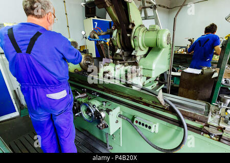 Two technicians working in factory Stock Photo