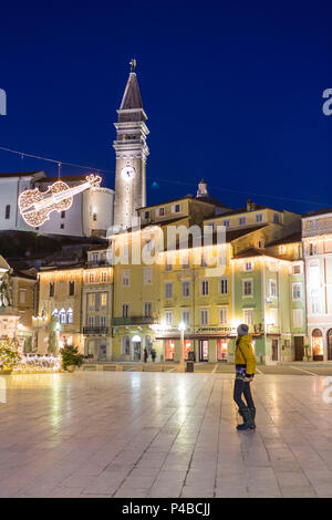 Woman stunning at Tartini square which was named after violinist and composer Giuseppe Tartini, Piran, Istria, Slovenia Stock Photo