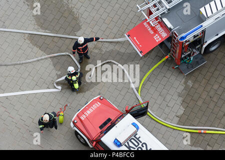 Vienna, fire department trucks, firemen connecting hoses, 22. Donaustadt, Wien, Austria Stock Photo