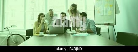 Serious worker brainstorming together Stock Photo