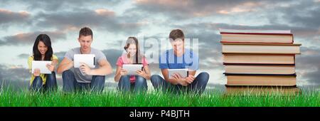 Composed image of students studying with tablets next to books Stock Photo