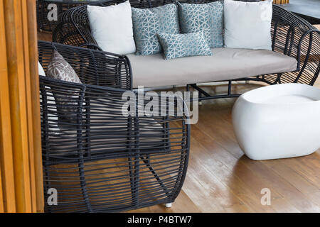 Modern furniture sofa set on wood floor background. Stock Photo