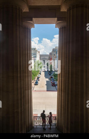 USA, District of Columbia, Washington, Reynolds Center for American Art, American Art Museum, silhouettes of couple among columns and 8th Street Stock Photo