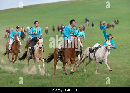 Young horsemen demonstrate team riding, Zhenglanqi Wuyi Farm, Inner Mongolia, China, Inner Mongolia, China Stock Photo