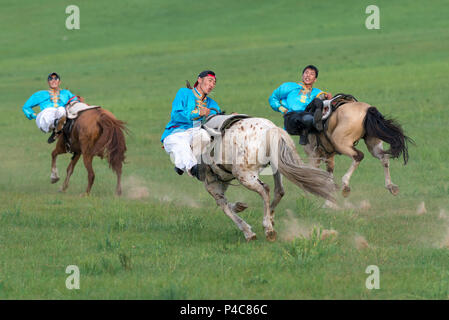 Young horsemen demonstrate team riding, Zhenglanqi Wuyi Farm, Inner Mongolia, China, Inner Mongolia, China Stock Photo