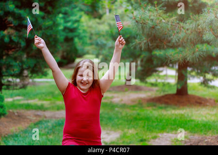 Funny little girl with waving american flag. Independence Day, Flag Day Stock Photo