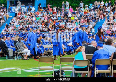 Crowd image of students at graduation ceremony from behind Stock Photo