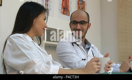 Medical personnel chatting during coffee break Stock Photo