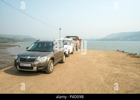 In the Konkan region of Maharashtra, India, at Agardanda a ferry transports people and vehicles across the Arabiann Sea creek. Stock Photo