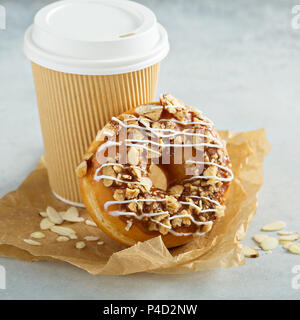 Almond and caramel glazed donut with cherry Stock Photo - Alamy