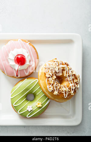 delicious glazed donuts with caramel. Top view Stock Photo - Alamy