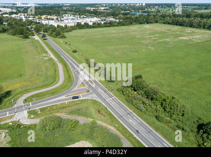 Aerial view of the turn-off of a ring road with the houses of the dominion in the background, near Wolfsburg Stock Photo