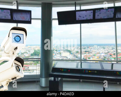 The CCTV Security Camera operating on control tower aviation blur background. Stock Photo