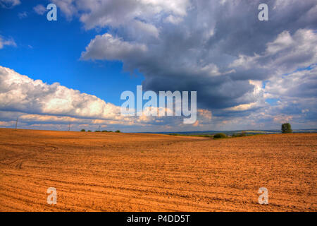 Ploughed field at late summer. HDR image. Poland, The Holy Cross Mountains. Stock Photo