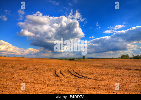 Ploughed field at late summer. HDR image. Poland, The Holy Cross Mountains. Stock Photo