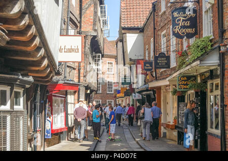 The Shambles, York, UK - August 05, 2011: Holiday makers busy doing their shopping in The Shambles market in York. Stock Photo