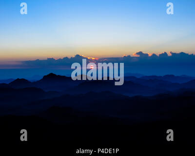 Sunrise in the holy summit of Mount Sinai, Aka Jebel Musa, 2285 meters, in Sinai Peninsula in Egypt. Copy space. Stock Photo