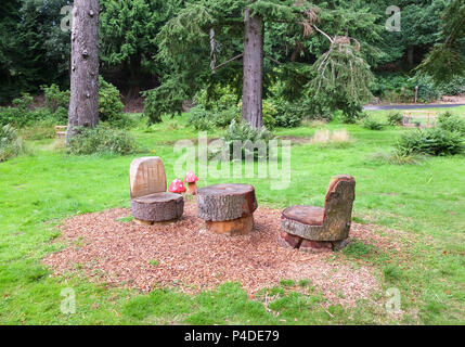 Dunkeld, Scotland, UK - August 16, 2013: Some garden carvings that have been thoughtfully carved out of fallen trees within the wooden areas of the Du Stock Photo