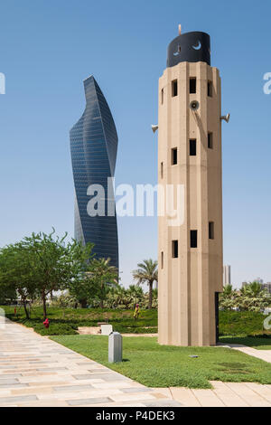 Skyscraper and Mosque Minaret at  Al Shaheed Park in Kuwait City, Kuwait Stock Photo