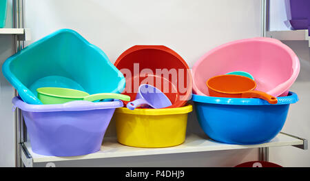 Plastic basins and scoops in store Stock Photo