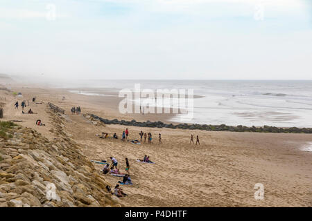 People enjoying the windy summer day at the beach on the Atlantic coast of France near Lacanau-Ocean, Bordeaux, France Stock Photo