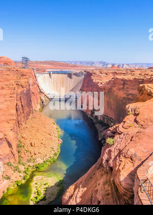 Glen Canyon Dam of Colorado River in northern Arizona, United States. Glen Canyon Dam forms the man-made Lake Powell, one of the largest reservoirs in the USA. Vertical shot. Stock Photo