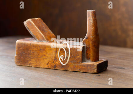 Old wooden planer on table in the workshop. Stock Photo