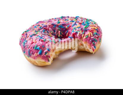 Pink frosted donut with bite missing on white background. Stock Photo