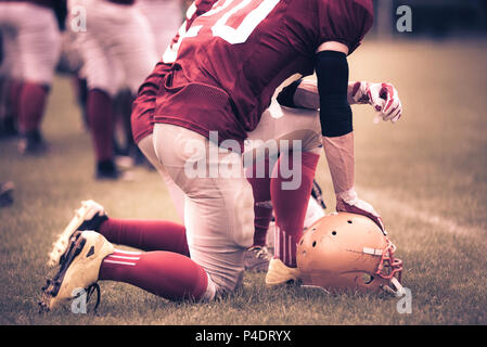 Toned image of an American Football player in action Stock Photo